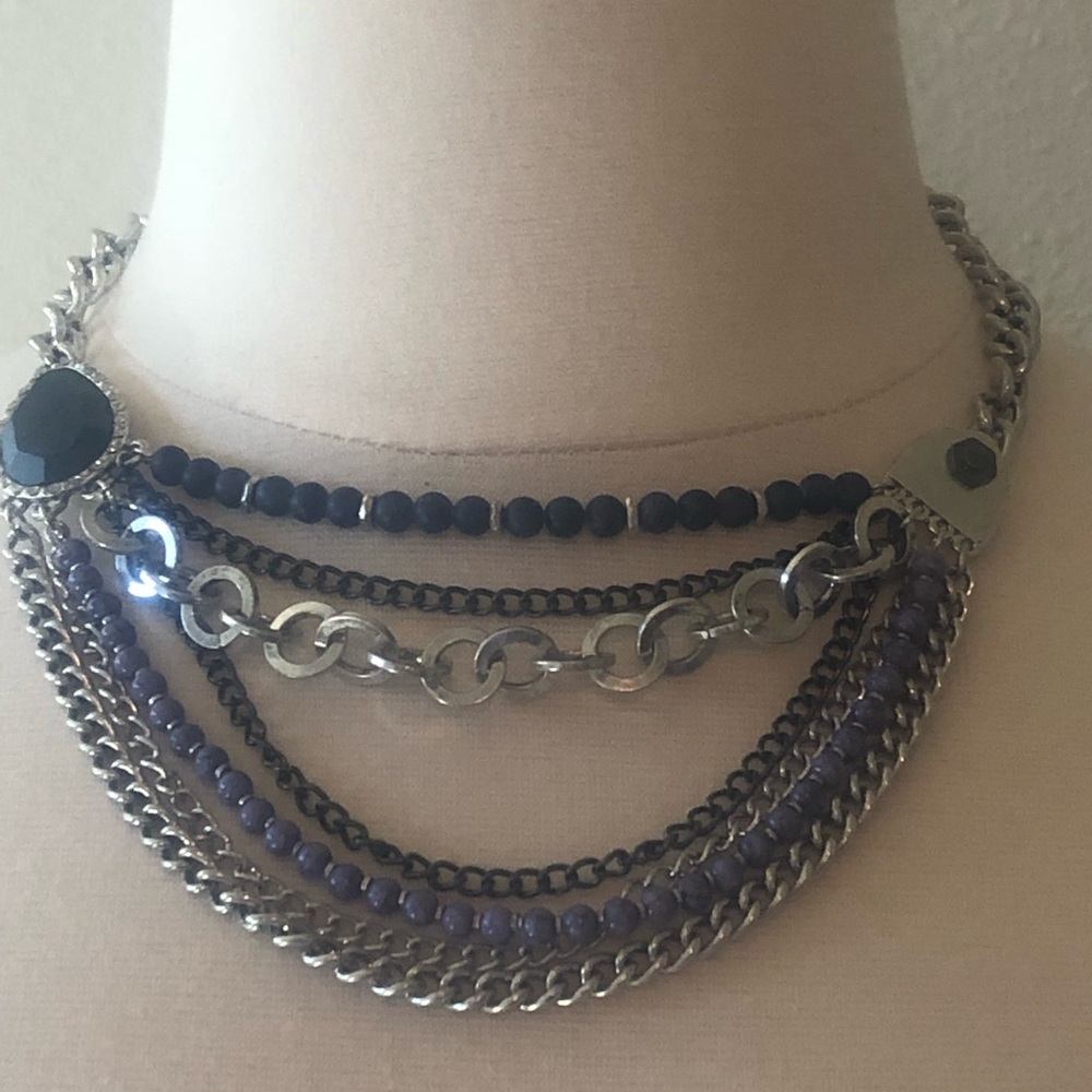 Blue and silver chain and bead necklace.